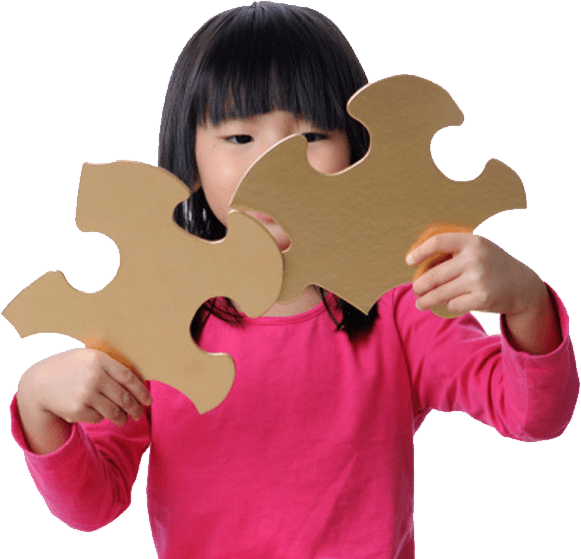 Girl playing with large puzzle pieces