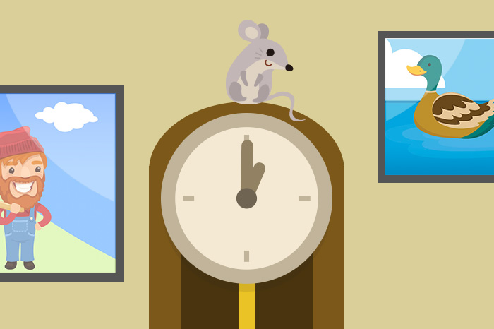 A mouse perched on top of a clock 